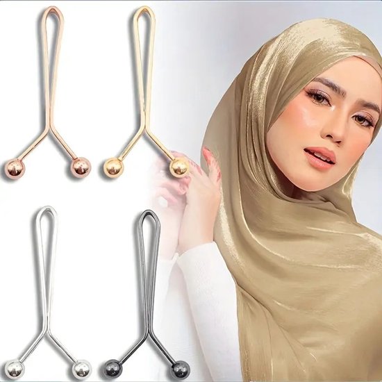 Gouden en zilveren brocheclips met bolle uiteinden, gedetailleerd op een model met een goudkleurige hijab.