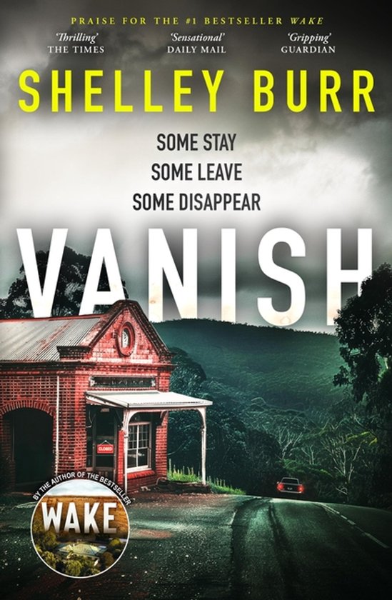 Boekcover met de titel 'Vanish' van Shelley Burr. Een bakstenen gebouw aan een weg met een duistere, heuvelachtige achtergrond.