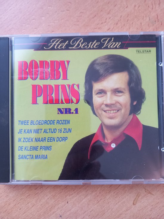 CD "Het Beste Van Bobby Prins NR.1" met zanger in zwart colbert en rode bies op de hoes.