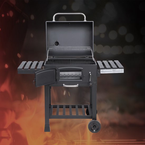 Zwarte TAINO kolengrill open met grillrooster en accessoires, met zijtafels.
