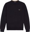 Pull bleu marine à col rond, le logo doré Fred Perry est visible sur la poitrine.