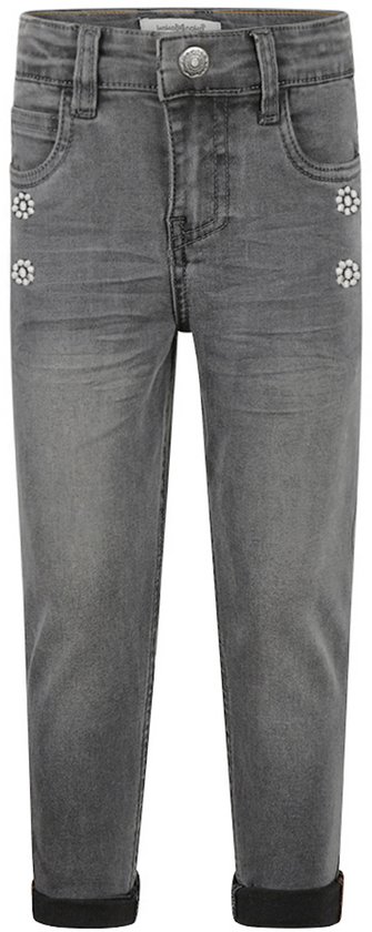 Donkergrijze jeans met bloemenknopen en opgerolde broekspijpen.