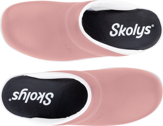 Bovenkant roze Skolys klompen met witte voering en zwarte binnenzool met Skolys logo.