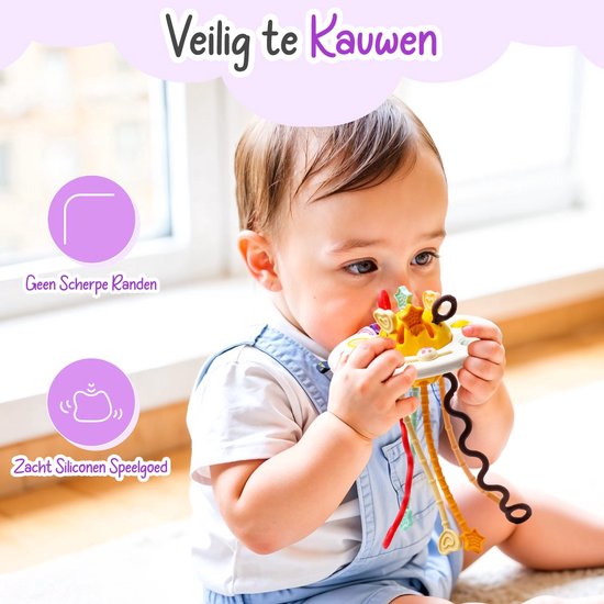 Baby speelt met UFO-speeltje met drukknoppen, draaiknoppen en gekleurde touwtjes.