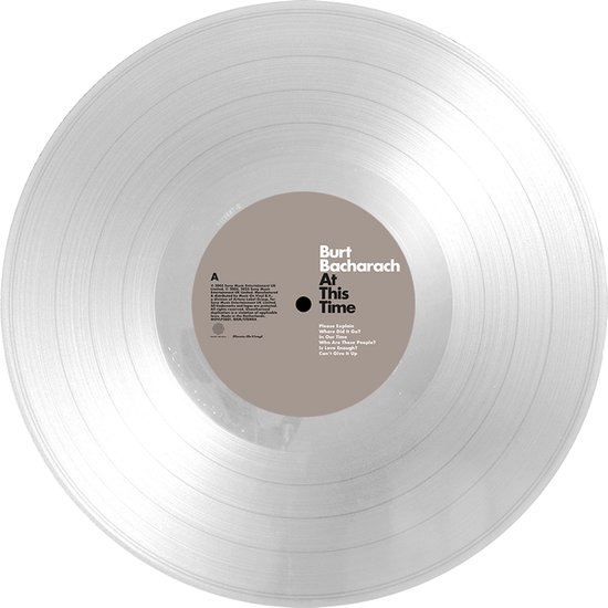 Grijze vinylplaat met het album "At This Time" van Burt Bacharach, met tracklist op het label.