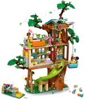 Een LEGO Friends-boomhut met speelfiguren, groen en bruin.