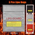 Drie LIPO GUARD tassen in zwart, zilver en rood, met afmetingen van 22.5 cm bij 18.5 cm.