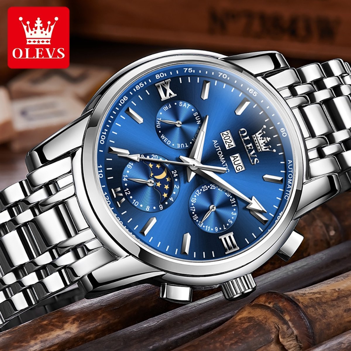 HO-6633.z-bl : OLEVS mechanisch edelstaal horloge, blauwe wijzerplaat, tachymeter, maand-dag, week-dag, jaar, maand, 24u maanfase - aanduiding