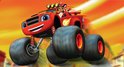 Blaze, de rode monstertruck met grote banden, rijdt door de lucht met een jochie met rode helm.