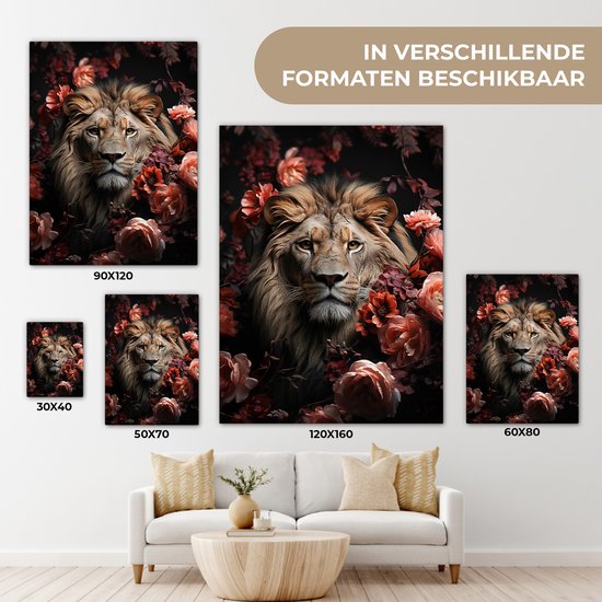 Verschillende formaten canvas schilderijen van een leeuw in bloemen, getoond boven een bank.
