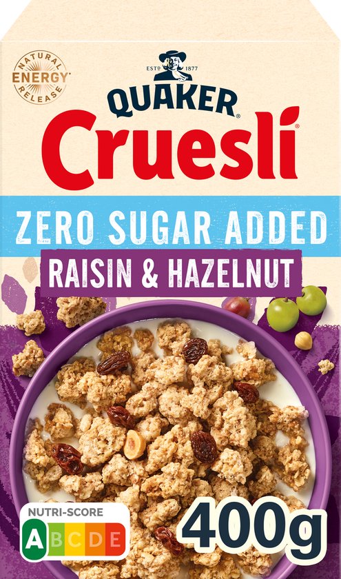 Pak Quaker Cruesli Raisin & Hazelnut Zero Sugar Added. Kom met ontbijtgranen, rozijnen, hazelnoten, druiven en melk.