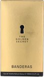 Gouden parfumdoos met sleutelgat en "THE GOLDEN SECRET" en "BANDERAS".