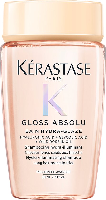 Bouteille Kérastase Gloss Absolu Bain Hydra-Glaze shampoo de couleur pêche.