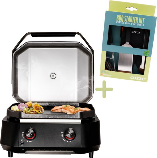 Zwarte Cozze gasplancha met open deksel, garen van zalmfilet en groenten. Naast de grill staat de verpakking van de BBQ Starter Kit.