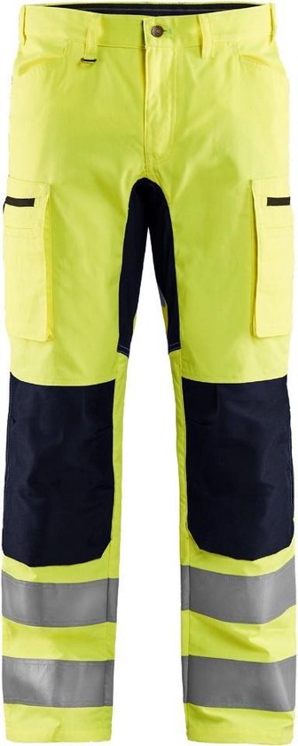 Pantalon de travail jaune avec empiècements noirs sur le haut des cuisses, bandes réfléchissantes sur les mollets. Deux poches à rabat.
