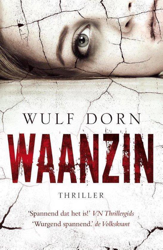 De cover van het boek 'Waanzin' van Wulf Dorn toont een gebarsten gezicht en de titel in rode letters.