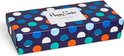 Een gesloten geschenkverpakking van Happy Socks met donkerblauwe ondergrond en veelkleurige grote stippen.