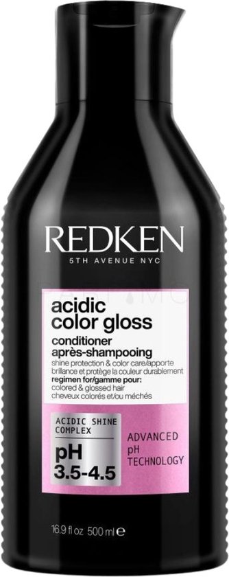 Bouteille de revitalisant noir Redken avec étiquettes roses et grises. Contient 500ml.