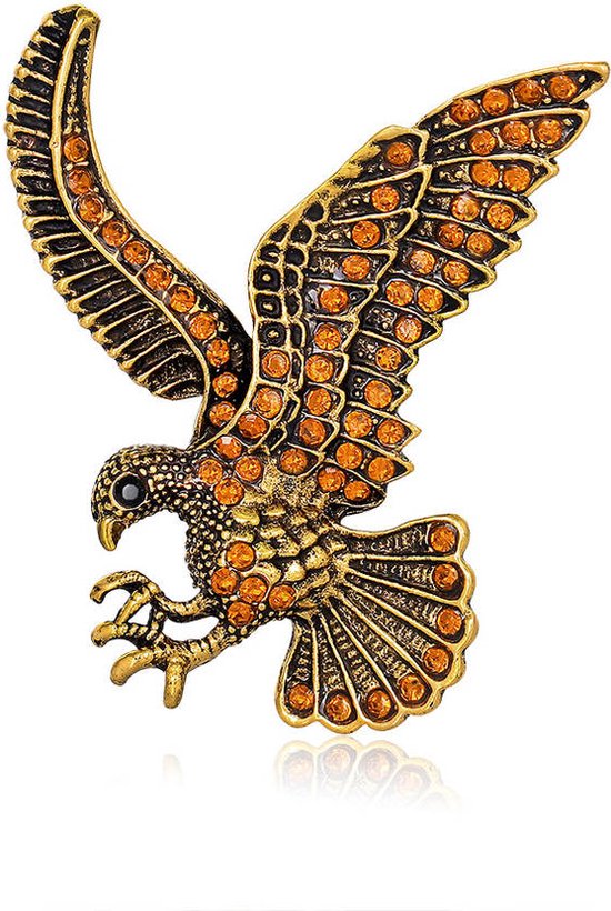 Broche aigle dorée ornée de strass orange.