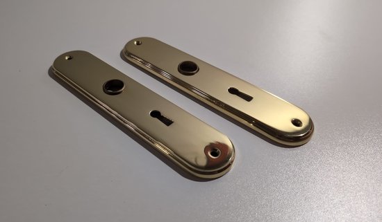 Deux rosaces de porte douces en laiton avec trou de serrure et trous de vis.