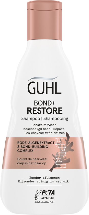 Witte fles Guhl Bond+ Restore shampoo met roze dop, met botanisch etiket.