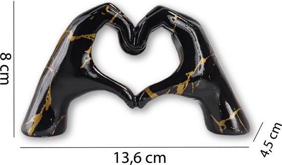 Zwart handbeeld met goudkleurige marmering, die een hartvorm vormen. Afmetingen: 8 cm hoog, 13,6 cm breed, 4,5 cm diep.