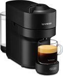 Zwarte Nespresso Vertuo Pop koffiecupmachine met een glas koffie.