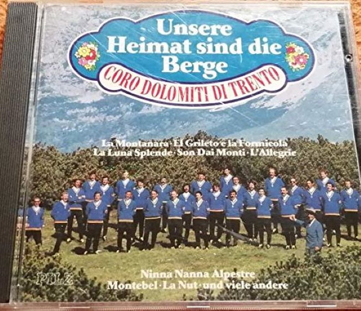 Coro Dolomiti Di Trento - Unsere Heimat sind die Berge (14 tracks, 1990)