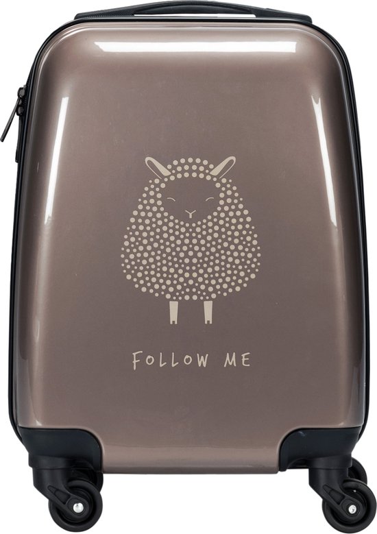 Koffertje in bronskleur met een schaap print en tekst 'Follow Me'.