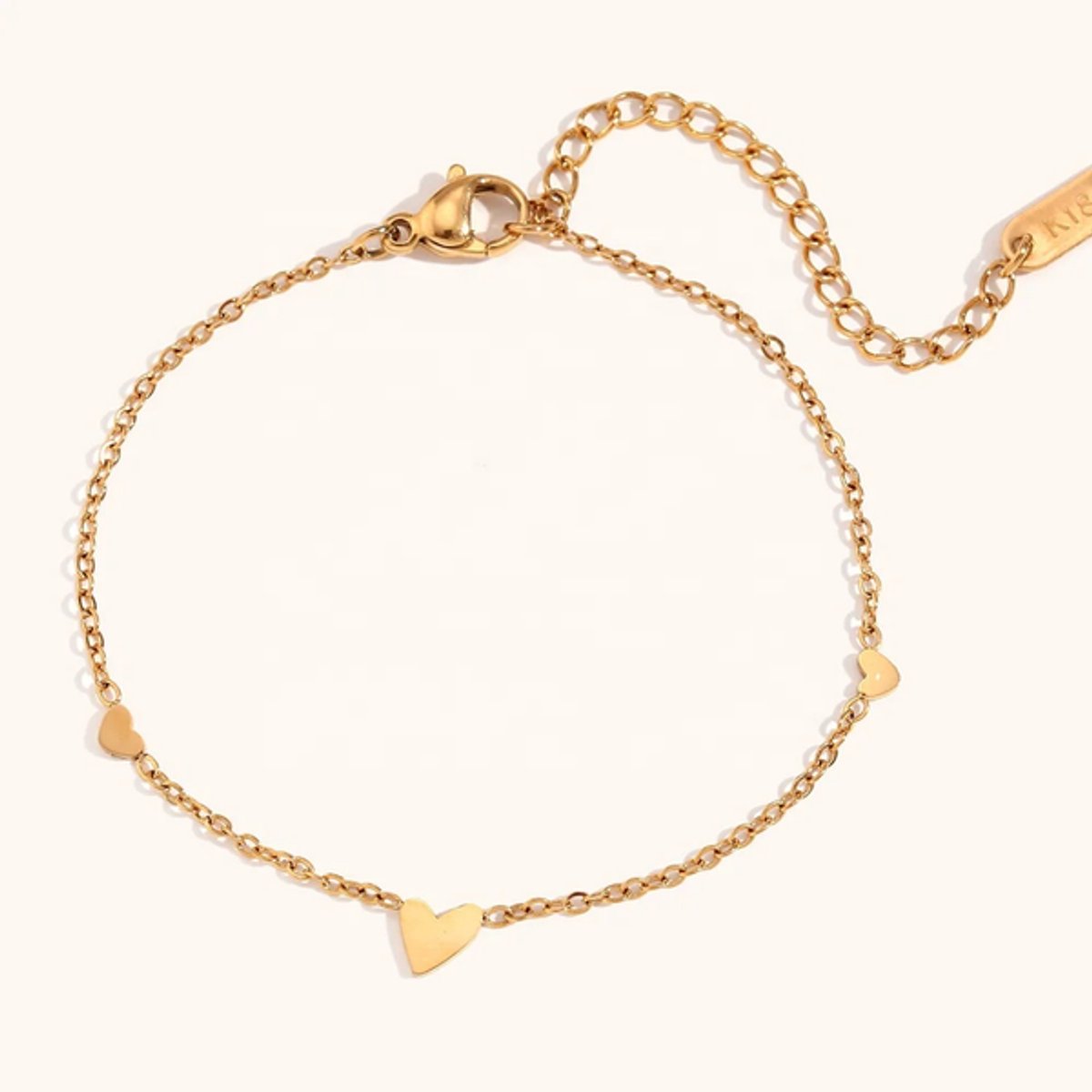 Fijne Schakelarmband met 3 hartjes - Stainless Steel - Hanger hart - verguld - The Jewellery Salon - armparty