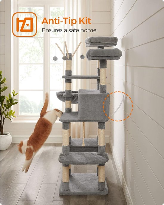 Grijze kattenboom met anti-tip kit. Een rood-witte kat springt van een plateau.