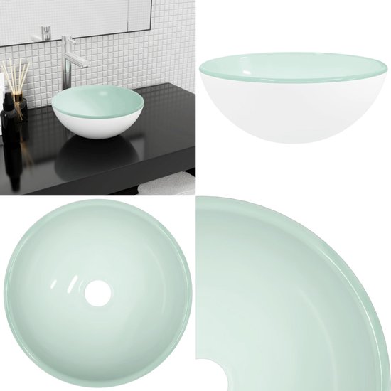 Lavabo blanc avec un bord vert clair.