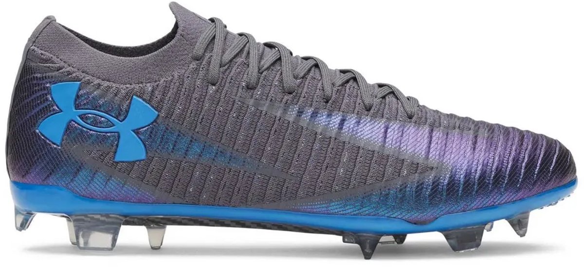 Grijze Under Armour Shadow Elite 3 FG voetbalschoenen EU 40, met blauwe accenten en een gestroomlijnd ontwerp voor snelheid.