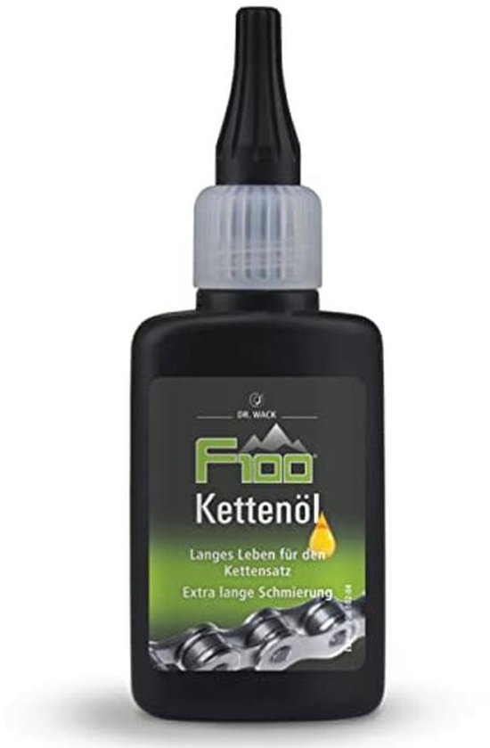 Zwarte fles met F100 Kettensöl, met afbeelding van een fietsketting en tekst 'Langes Leben für den Kettensatz. Extra lange Schmierung.'
