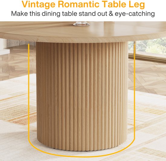 Detail van de gecanneleerde, cilindervormige houten poot van een ronde eettafel.