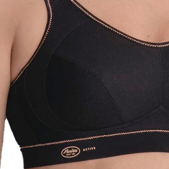 Zwarte sportbeha met koperkleurige biezen, gedetailleerde cups en Anita Active logo.