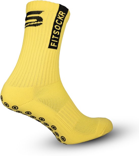 Chaussette de sport jaune avec bande noire et logo. Picots noirs sous le pied.