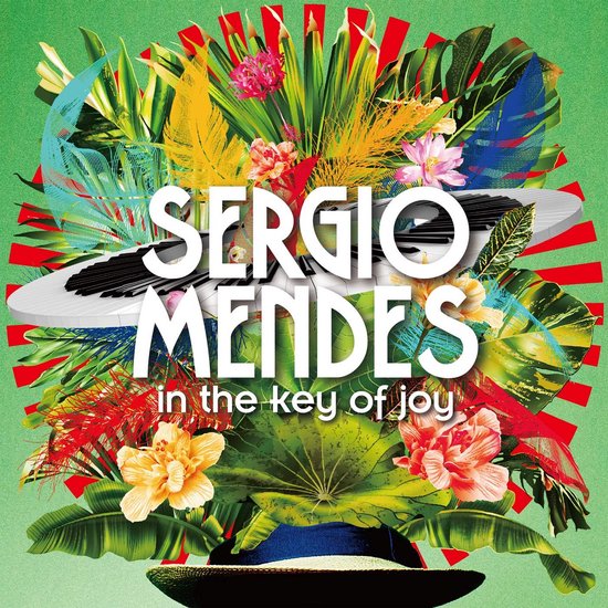 Albumhoes Sergio Mendes In the Key of Joy met een toetsenbord tussen kleurrijke tropische bloemen en bladeren.