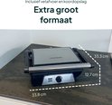 Vivid Green contactgrill gesloten, met afmetingen "33,8 cm", "33,3 cm", "12,7 cm". "Extra groot formaat", "Inclusief vet afvoer en koordopslag".