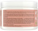 Ingrediëntenlijst en "Our Story" op de achterkant van de pot Shea Moisture Coconut & Hibiscus Curl Enhancing Smoothie.