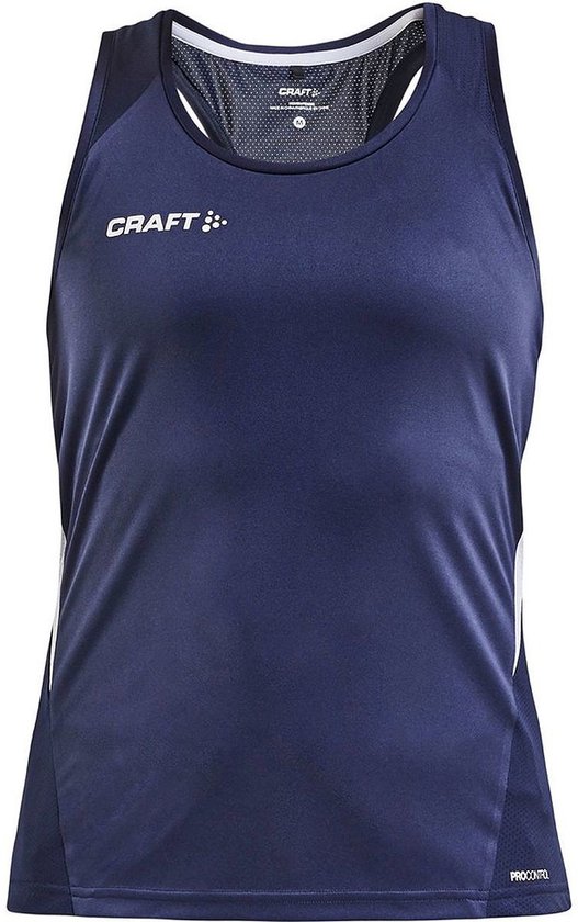 Débardeur de sport bleu marine de Craft avec des accents blancs sur les côtés. Le débardeur a un col rond et un dos nageur.