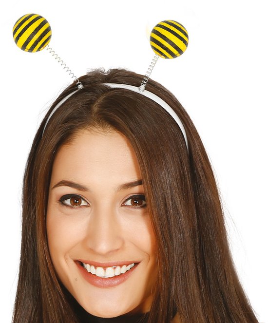 Vrouw met diadeem met twee zwart/gele bijenkopjes op spiraalveren.
