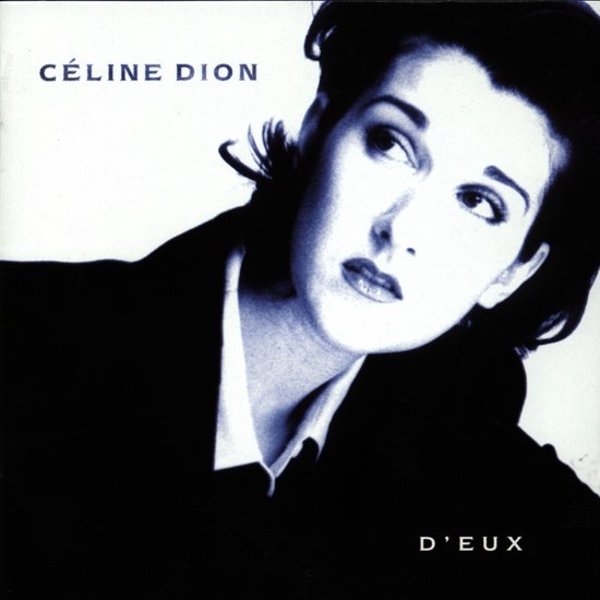 Céline Dion, D'eux albumhoes met haar hoofd schuin naar rechts gedraaid, zachtjes lachend, in een donker pak.