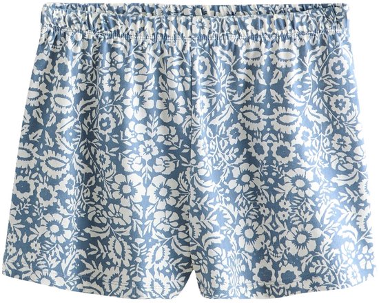 Korte blauwe pyjamabroek met all-over witte bloemenprint.