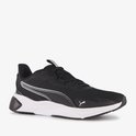 Zwarte Puma sportschoen met witte zool, zilveren strepen op de zijkant en Puma-logo.