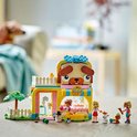 Set LEGO Friends de boutique d'accessoires pour animaux aux couleurs rose, jaune et bleu, toit en forme de tête de chien.