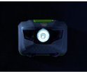 Grijze hoofdlamp met een helder witte lichtstraal naar voren gericht.