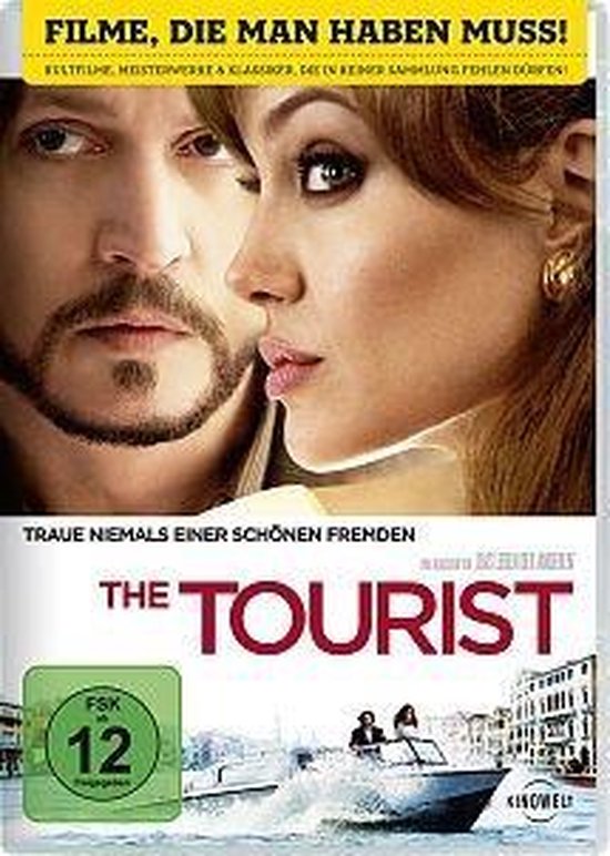 De DVD-cover van 'The Tourist' toont een close-up van de gezichten van Angelina Jolie en Johnny Depp, met op de achtergrond een boot in Venetië.