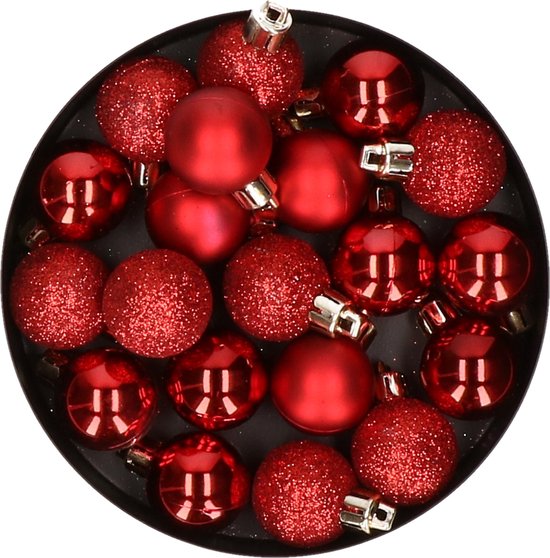 Un bol rond avec des boules de Noël, boules rouges à paillettes et rouge brillant.