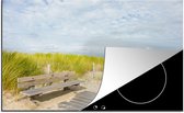 KitchenYeah® Inductie beschermer 76x51.5 cm - Harde wind bij Nederlands strand - Kookplaataccessoires - Afdekplaat voor kookplaat - Inductiebeschermer - Inductiemat - Inductieplaat mat